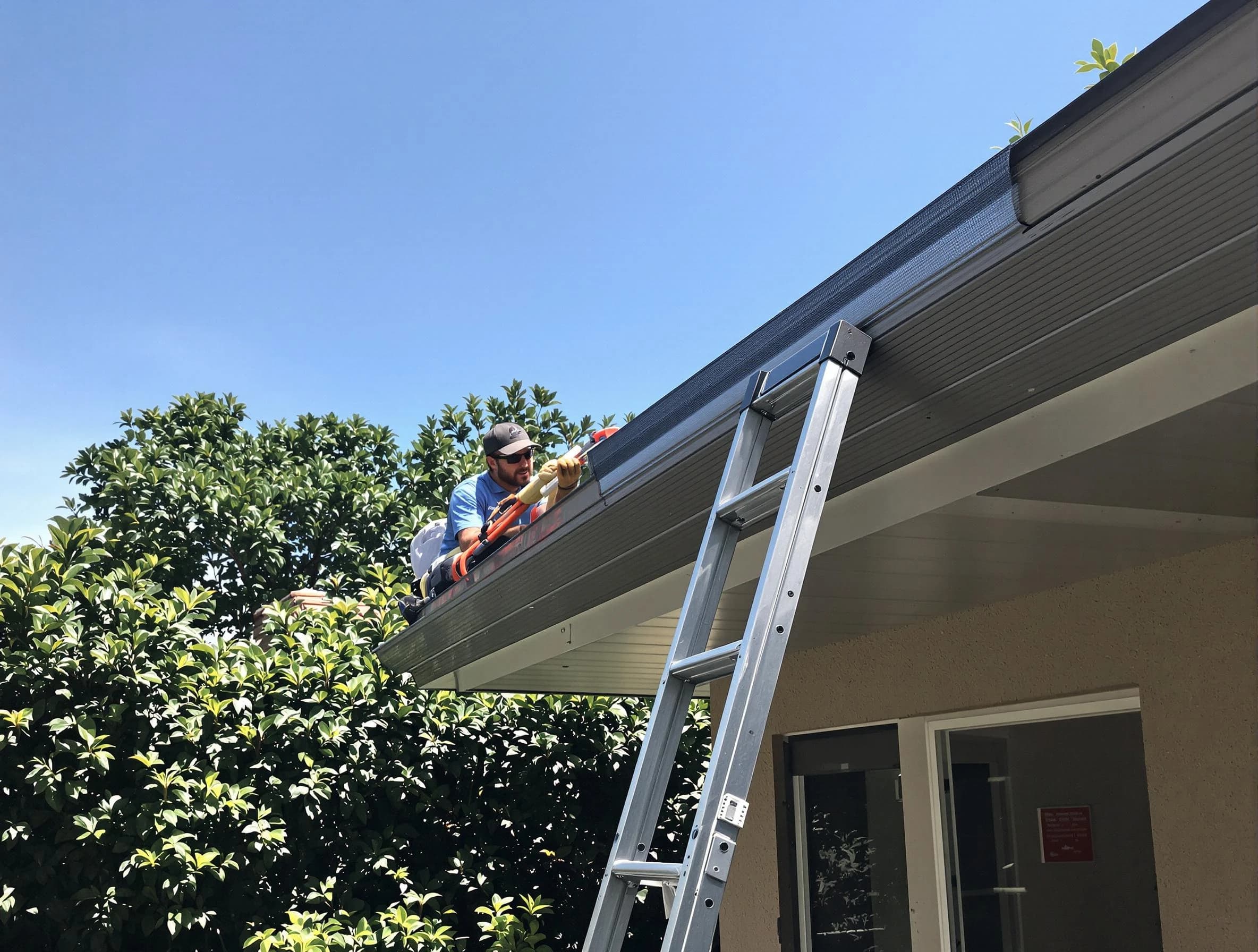 Fairview Park Roofing Company installing gutter guards for a homeowner in Fairview Park, OH